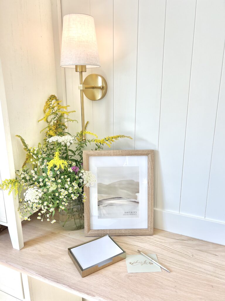 Desk workspace with flowers and light for homeschooling