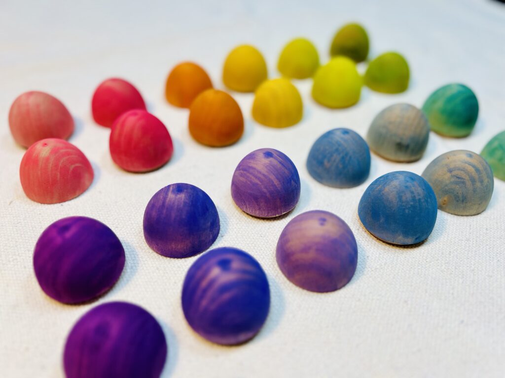 Colorful eggs drying on white tablecloth