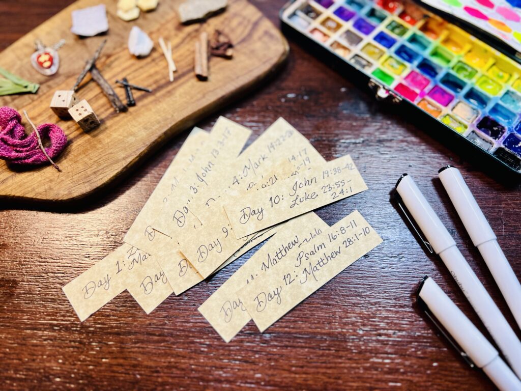 Handwritten verses on table with contents for eggs and paint